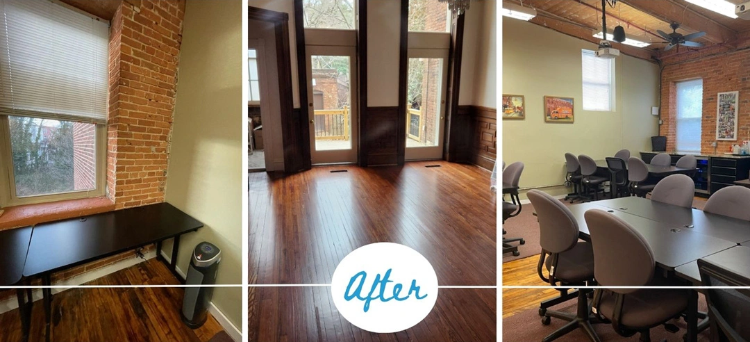 Renovated workspace featuring warm wooden floors, exposed brick, a desk, and a collaborative meeting area with modern furnishings.